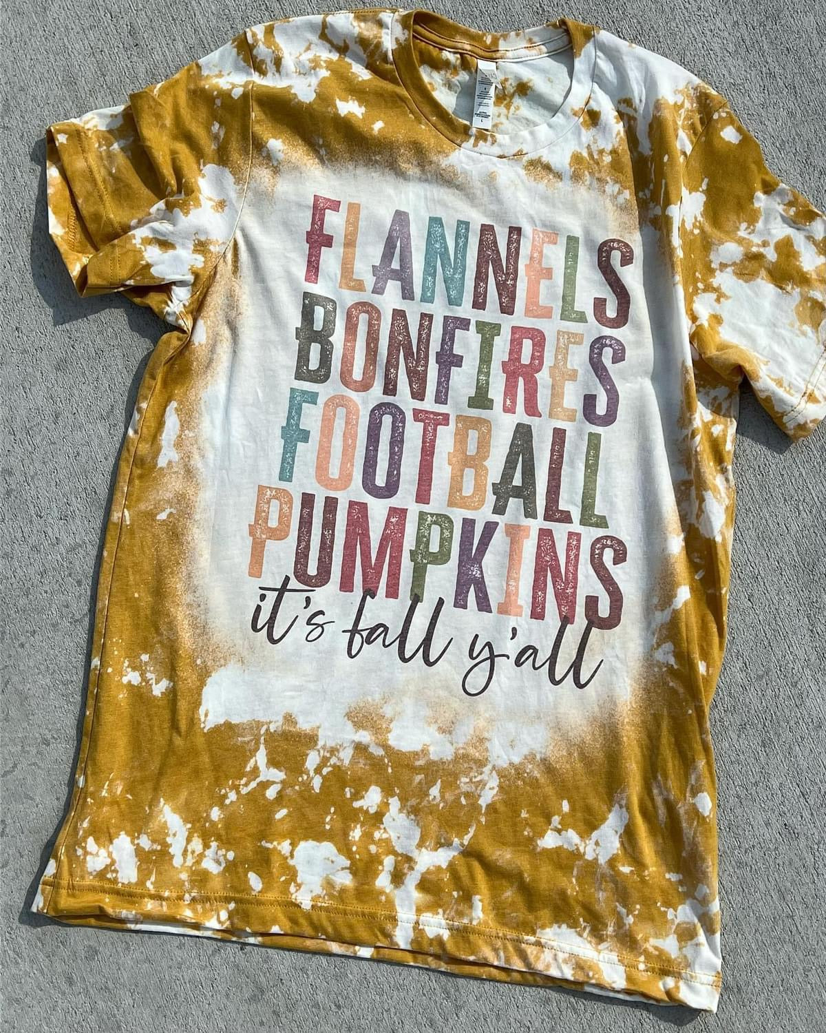 Flannels bonfires football pumpkins it’s fall y’all
graphic shirt