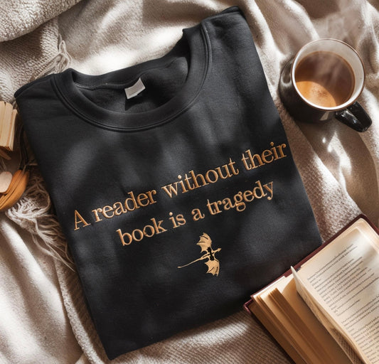 A reader without their book is a tragedy embroidered shirt