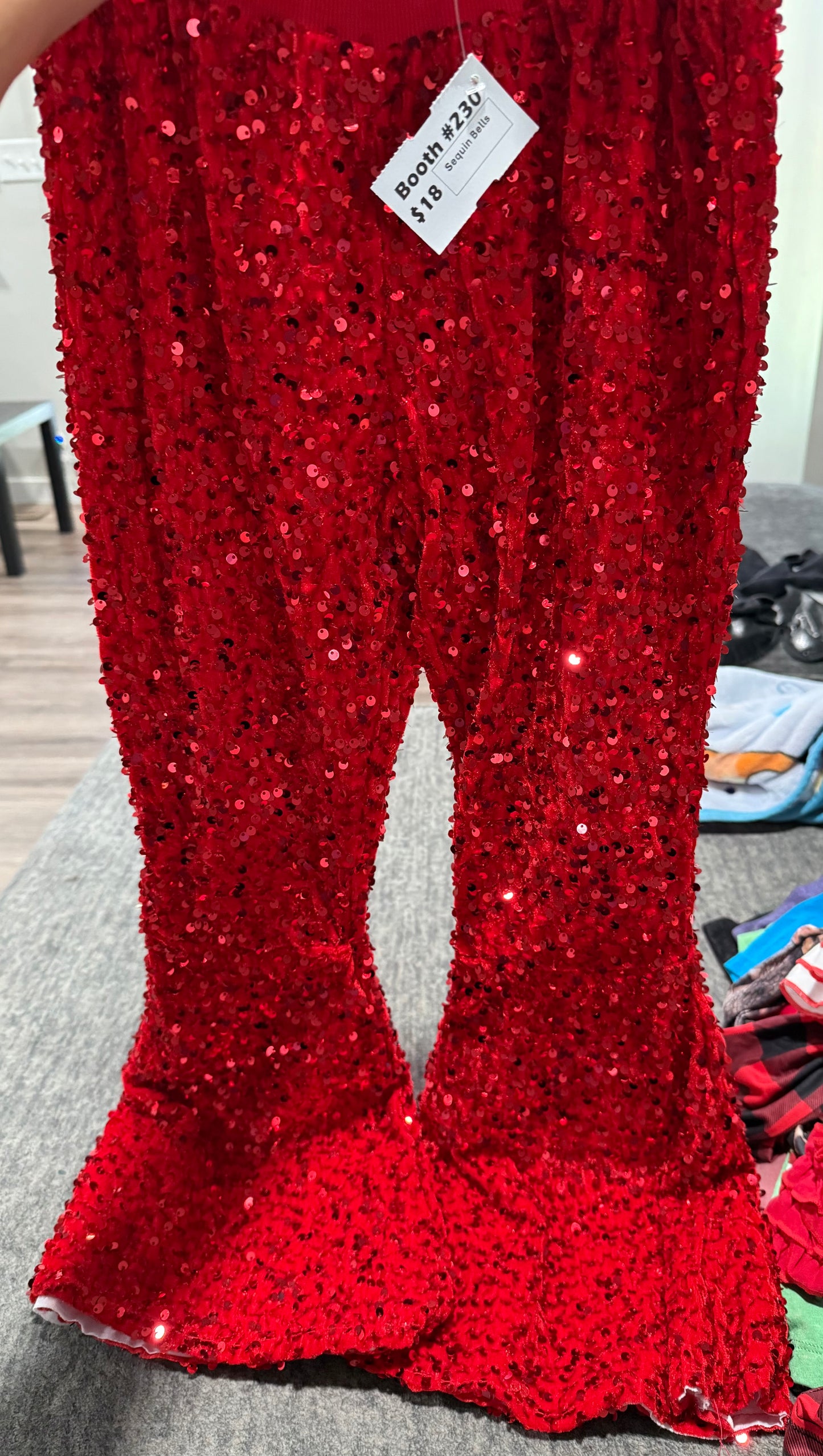 Red colored sequin bell bottoms